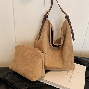 Detail of khaki suede hobo bag with matching pouch and brown leather strap
