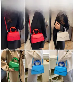 Collage of colorful crossbody bags featuring curved metal handles in various colors