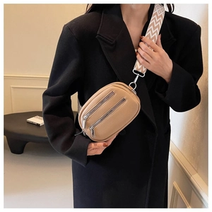 Light camel cross-body bag with pebble texture and geometric pattern wide strap