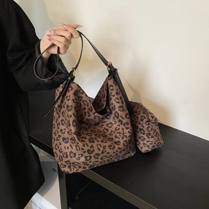 Detail of leopard print tote bag with matching coin purse and adjustable leather strap