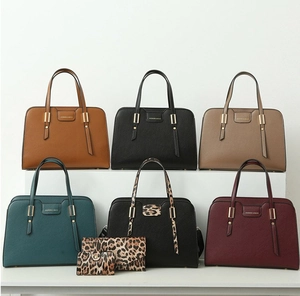 Tote bags collection in various colors with leopard print wallets on white steps