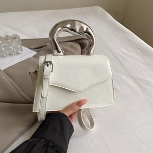 Minimalist white leather handbag with unique silver liquid metal handle and flap cover