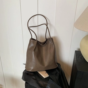 Minimalist deep brown faux leather tote bag with soft pleats and double shoulder straps