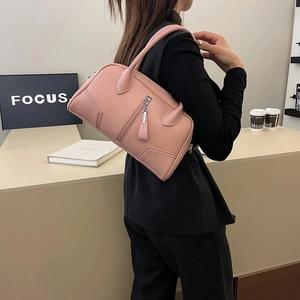 Pink lychee grain leather handbag for women featuring metal zipper and long handles