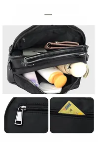 Top view of large capacity black nylon bag showing multi-layer interior and storage space