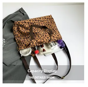 Top view of leopard print canvas tote bag showing interior storage capacity and items