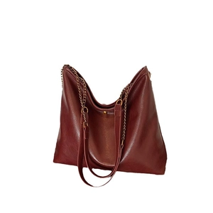 Deep red vintage tote bag in lychee texture faux leather with gold chain straps