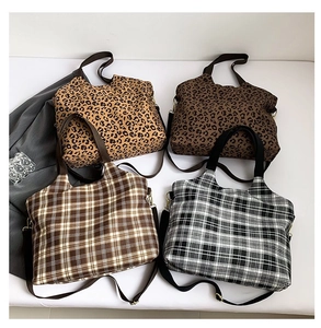 Detail showing four styles of leopard print and plaid tote bags with adjustable straps