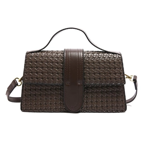 Caramel brown woven leather handbag with a gold buckle and adjustable shoulder strap
