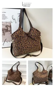 Macro shot of coffee leopard print canvas tote bag with adjustable strap and gold hardware