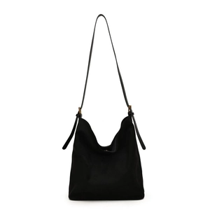 Minimalist black matte hobo bag with adjustable leather shoulder strap and metal buckles