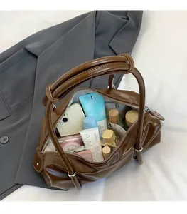 Interior view of brown PU Boston bag showing spacious storage for essentials and phone