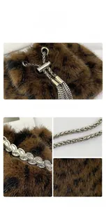 Detail of leopard print faux fur bucket bag with silver chain and rhinestone leaves