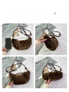 Detail of leopard print plush dumpling bag with cord strap and mobile phone for size scale