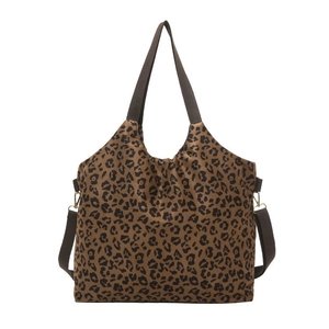 Large leopard print tote bag with brown straps and adjustable shoulder strap for daily commuting