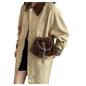 Winter brown faux fur bucket bag with silver chain strap shown on khaki coat model