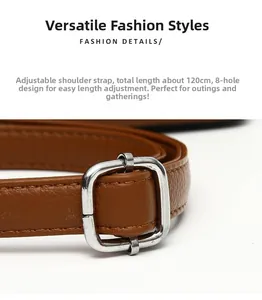 Detail of brown litchi grain PU leather strap with silver adjustable buckle and 8 holes