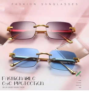 Detail of rimless square sunglasses featuring gradient lenses and gold metal temples
