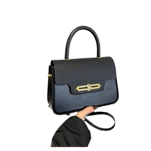 Lizard texture leather handbag with gold metal clasp and adjustable shoulder strap