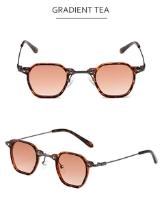 Détail de lunettes de soleil hexagonales rétro avec verres dégradés et monture écaillée