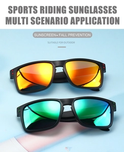 Detail view of sports riding sunglasses featuring colorful mirror lenses and matte frames