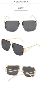 Detail view of grey lens aviator sunglasses with gold metal frame and geometric hollow temples