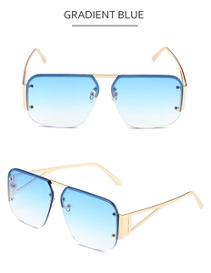 Detail view of square rimless pilot sunglasses with gradient blue lenses and gold metal frames