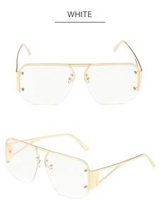 Detail of light gold square semi-rimless frames with geometric hollow temples in white