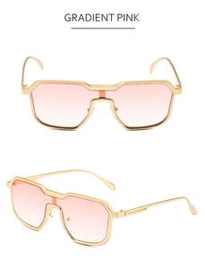 Detail of gradient pink lenses and irregular golden metal frame on steampunk sunglasses