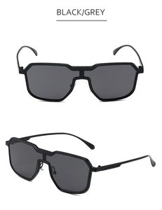 Detail view of steampunk irregular metal sunglasses with black frame and grey lenses