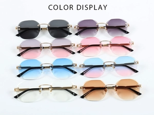 Close-up of engraved metal temples and bridge on rimless hexagonal sunglasses set