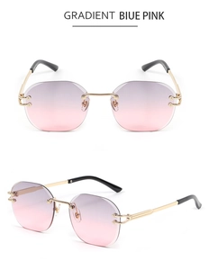 Detail of snake-shaped rimless sunglasses with gradient blue pink lenses and gold metal frames