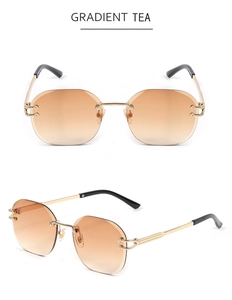 Detail of rimless gradient tea sunglasses with golden C-shape metal hinge and temples