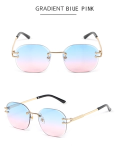 Detail of rimless gold metal sunglasses with gradient blue pink lenses and textures