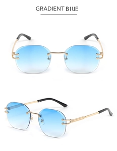 Detail of rimless geometric sunglasses with gradient blue lenses and gold metal frame