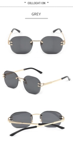 Detail view of grey rimless snake-style sunglasses with gold metal temples and hinges