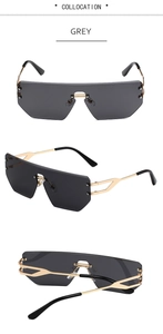 Detail of grey rimless polygonal sunglasses with gold metal temples and hollow design