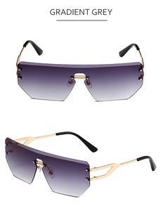 Detail of rimless gradient grey sunglasses with geometric cut lenses and gold metal frame