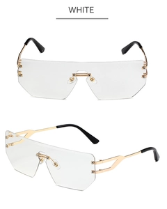 Detail of rimless shield sunglasses with white geometric lenses and gold hollow temples