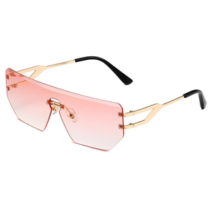 Modern rimless shield sunglasses with pink gradient lenses and gold metal temples