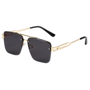 Fashionable square frame sunglasses with black lenses and gold metal geometric temples