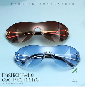 Detail of Y2K rimless sunglasses featuring star metal accents and gradient brown lenses