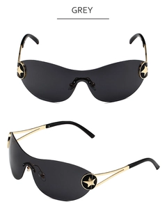 Detail view of Y2K rimless grey lens sunglasses with golden star emblem on temple