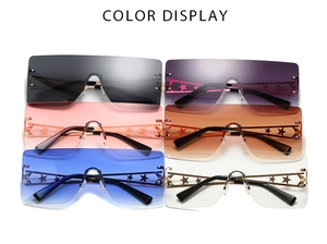 Detail of rimless oversized sunglasses with hollow metal star on the temple arms