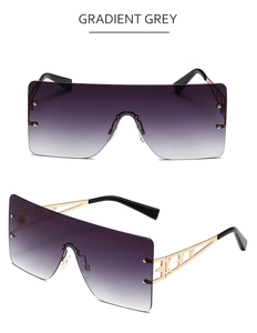 Detail of gradient grey rimless sunglasses with gold metal star cutout on the temples