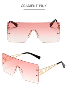 Detail of shield sunglasses with gradient pink lenses and hollow star metal temples