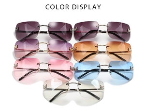 Close-up of frameless Y2K sunglasses with sparkling crystal butterfly details in various colors