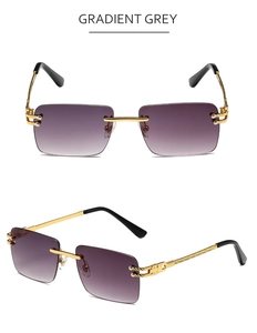 Detail of rimless square sunglasses with gradient grey lenses and gold metal frame