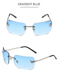 Macro shot of rimless gradient blue lens with crystal butterfly detail in Y2K style