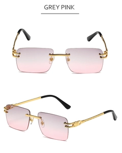 Detail of rimless square sunglasses with grey pink gradient lenses and golden carved temples